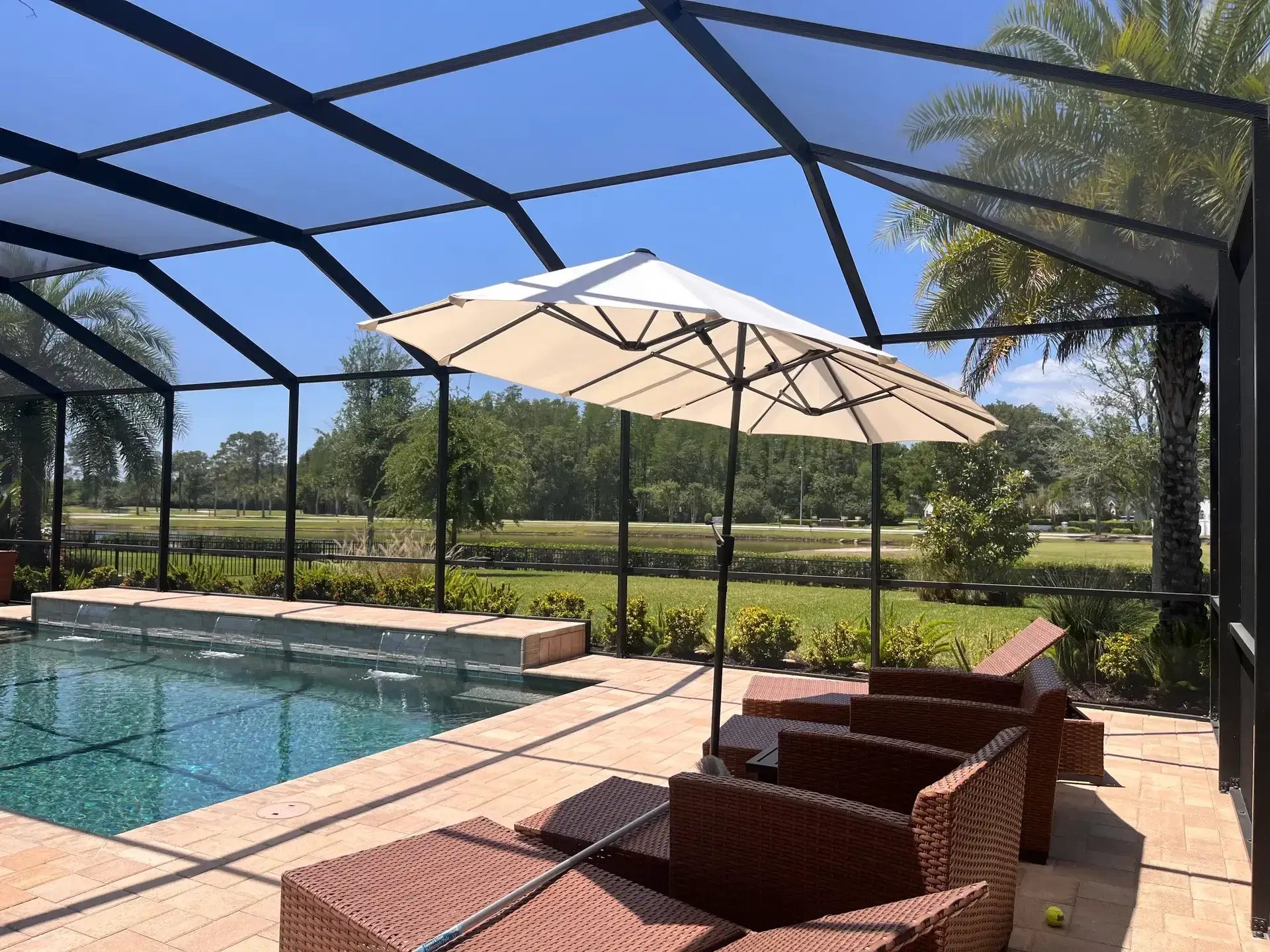 Finished Cheval pool enclosure and patio after the screen restoration project.